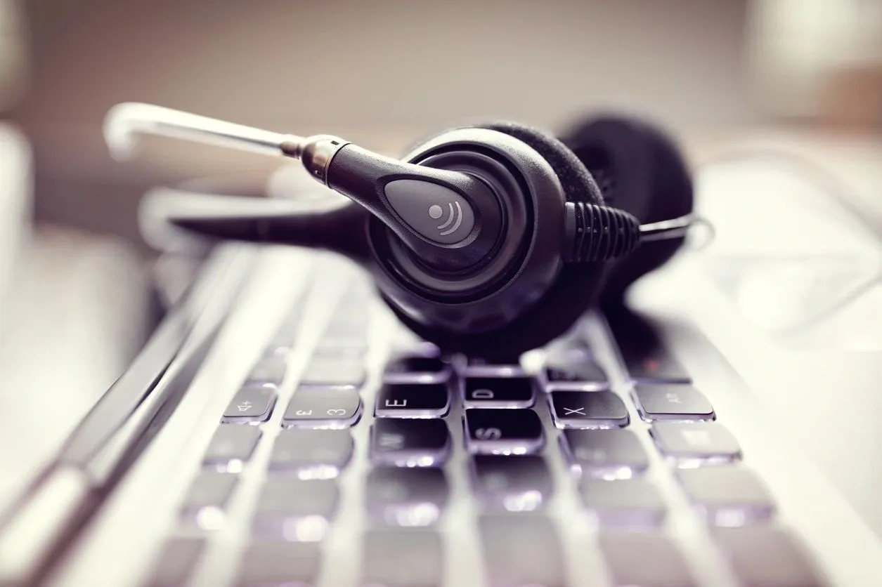 A keyboard with headphones on it